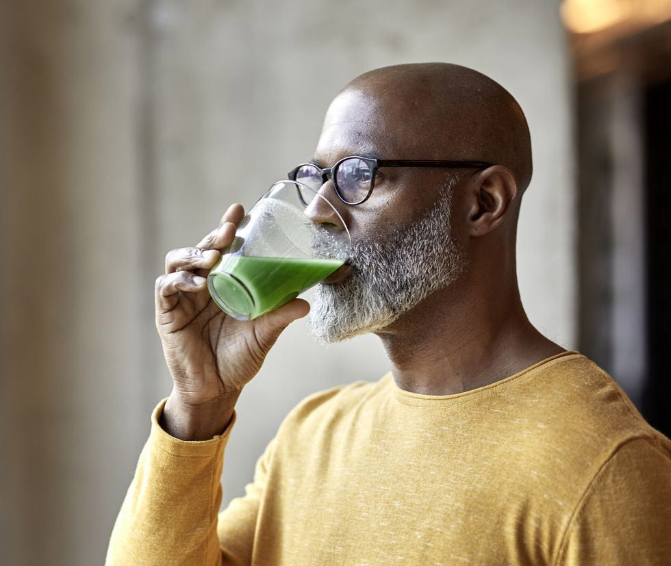 Man drinking Kabooya Green Blend